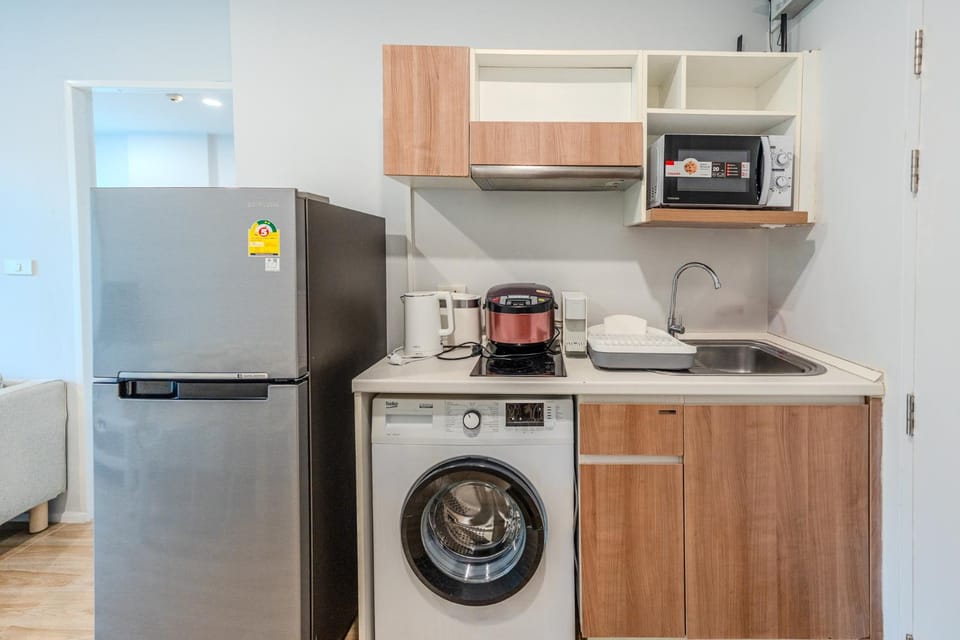 Kitchen or kitchenette, microwave, stove, washing machine