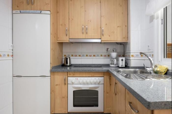 Kitchen or kitchenette, oven, stove, toaster