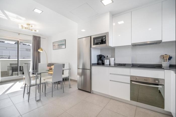 Kitchen or kitchenette, Living room, Seating area, Dining area, oven, stove, toaster