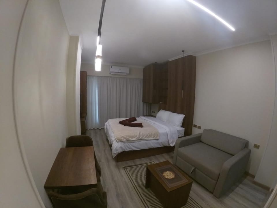 Bed, Living room, Seating area, Bedroom