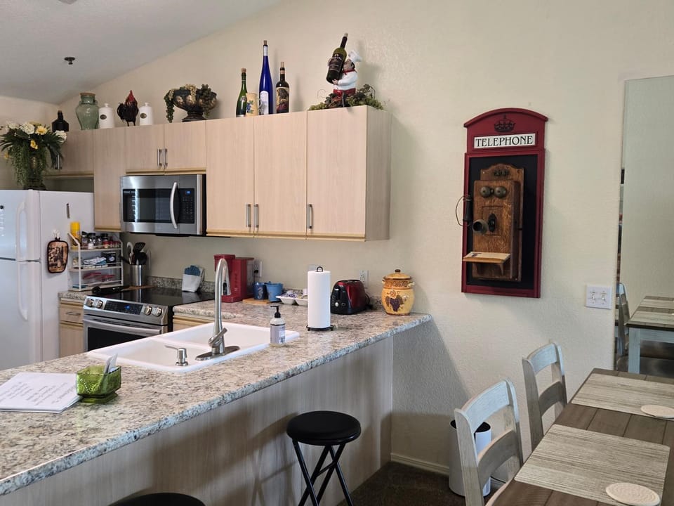 Dining area, dishwasher, stove, toaster, kitchen