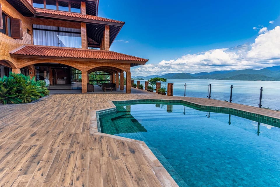 Property building, Patio, Nearby landmark, Day, Mountain view, Pool view, Sea view, Swimming pool, Swimming pool