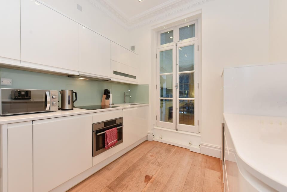 Kitchen or kitchenette, dishwasher, oven, stove