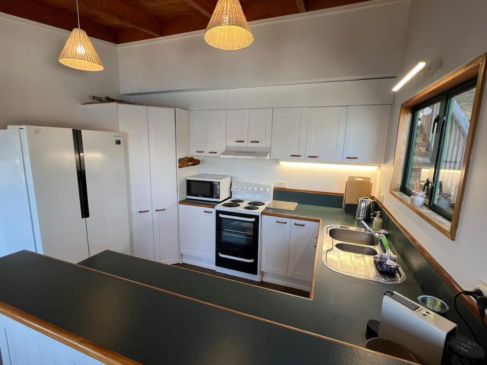 Kitchen or kitchenette, dishwasher, oven, stove, toaster