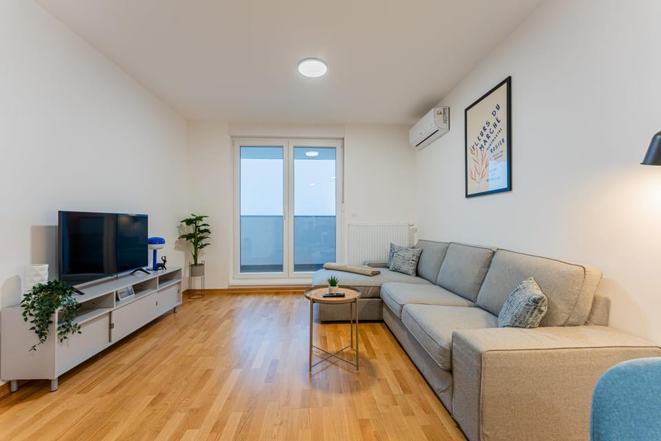 Property building, TV and multimedia, Living room, Seating area, air conditioner