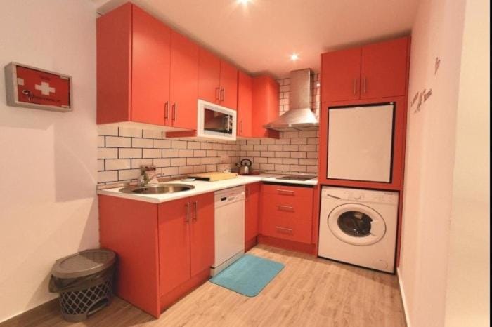 Kitchen or kitchenette, washing machine