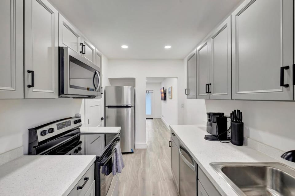 Kitchen or kitchenette, dishwasher, oven, stove, toaster