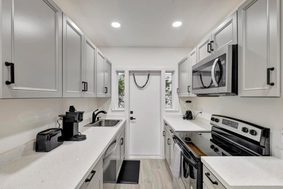 Kitchen or kitchenette, dishwasher, stove, toaster