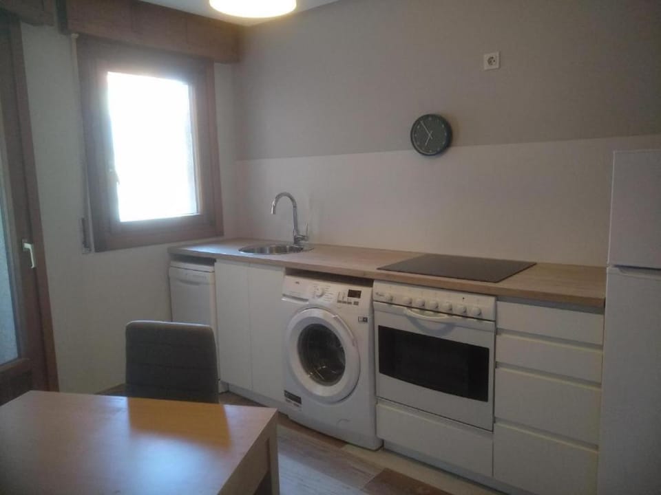 Kitchen or kitchenette, dishwasher, stove, washing machine