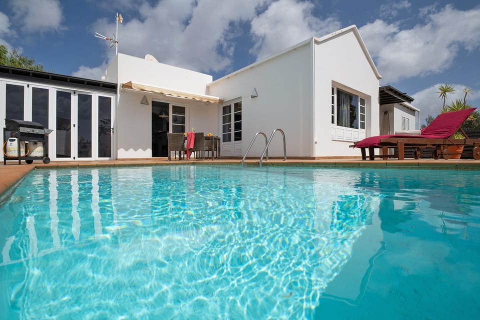 Property building, Living room, Swimming pool
