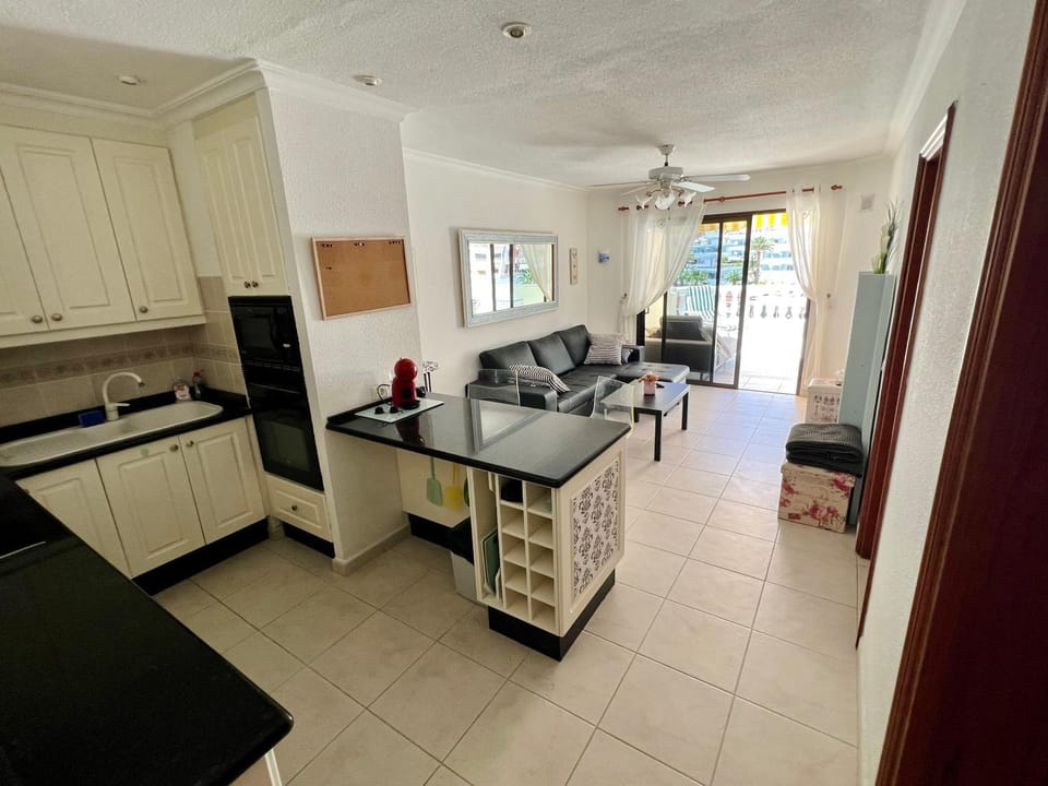 Kitchen or kitchenette, microwave, oven, stove