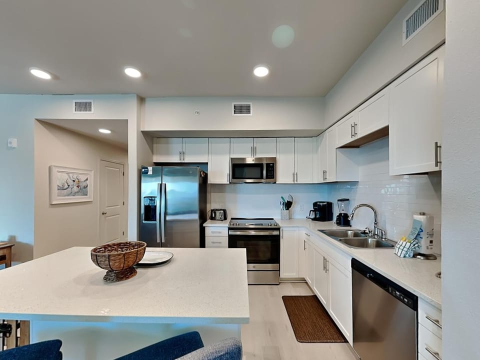 Kitchen or kitchenette, dishwasher, microwave, stove, kitchen, air conditioner