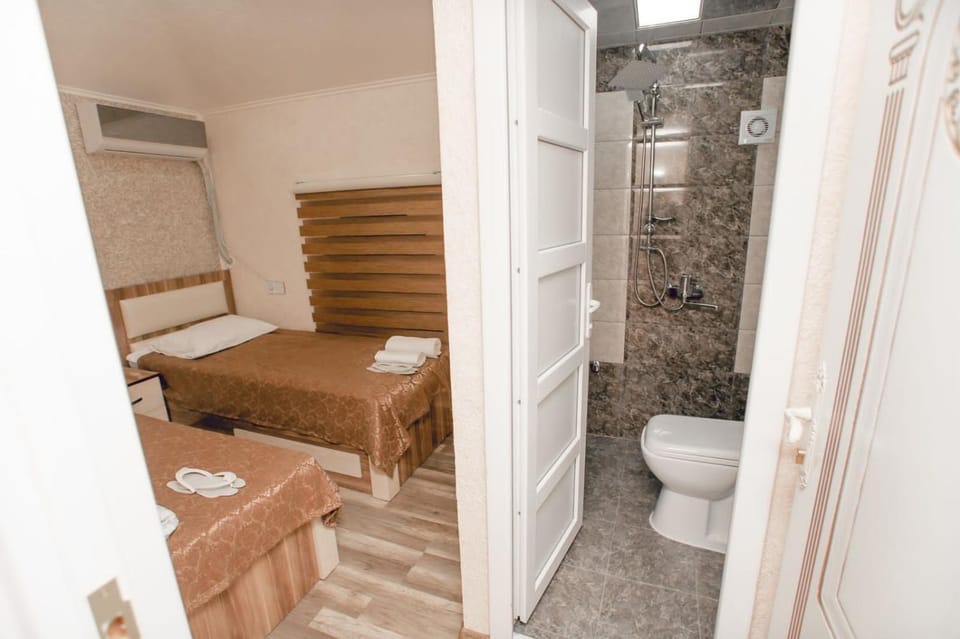 Shower, Toilet, Bed, Photo of the whole room, Bedroom, bidet, towels