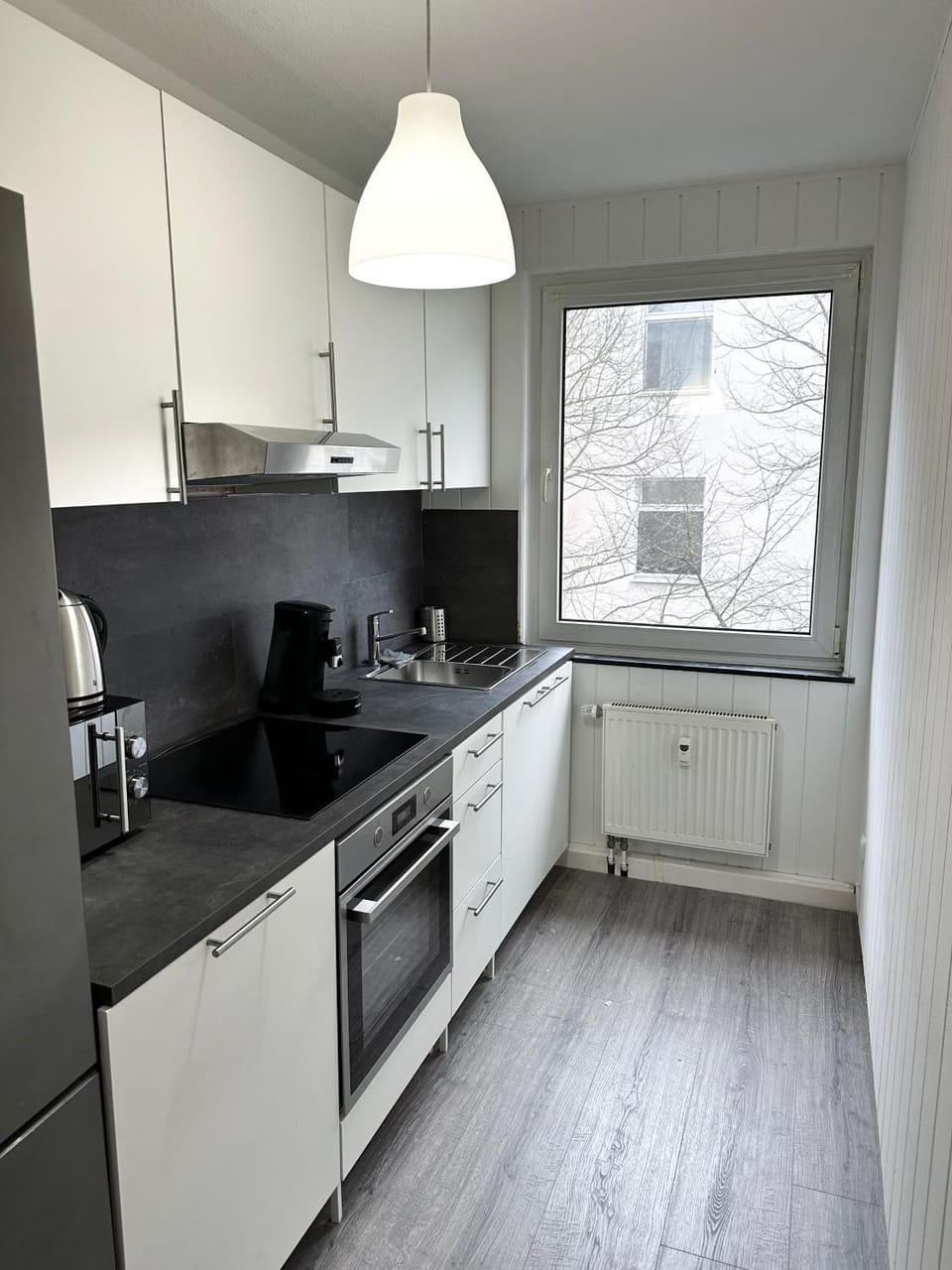 Kitchen or kitchenette, dishwasher, microwave, oven, stove, toaster