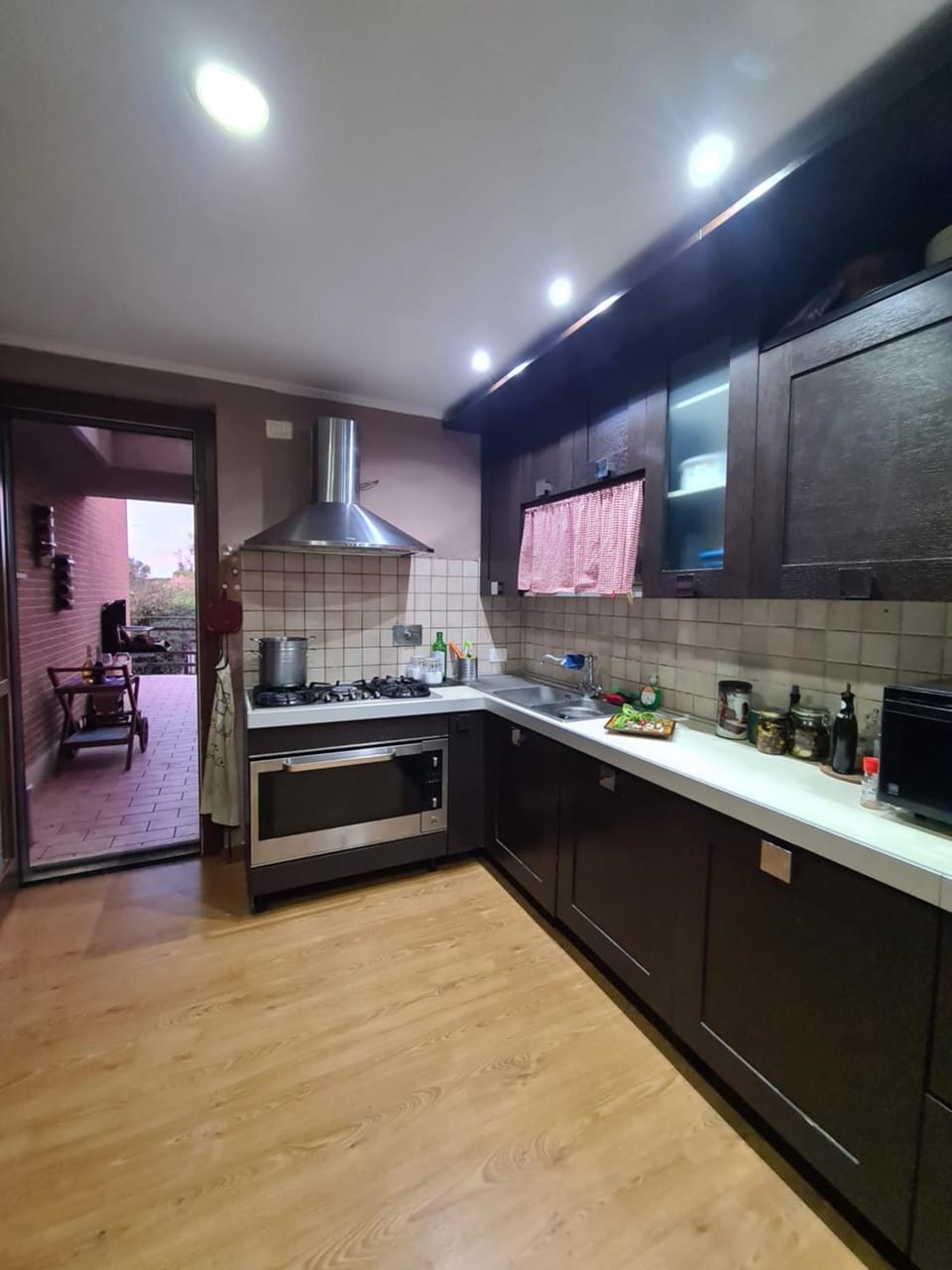 Kitchen or kitchenette, dishwasher, heating, microwave, oven, stove, toaster