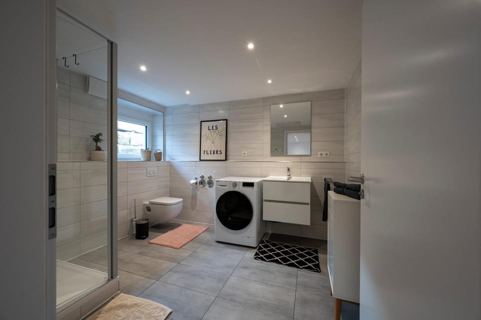 Shower, Toilet, Bathroom, towels, washing machine, dryer