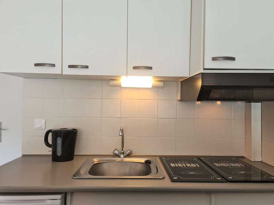 Kitchen or kitchenette, stove