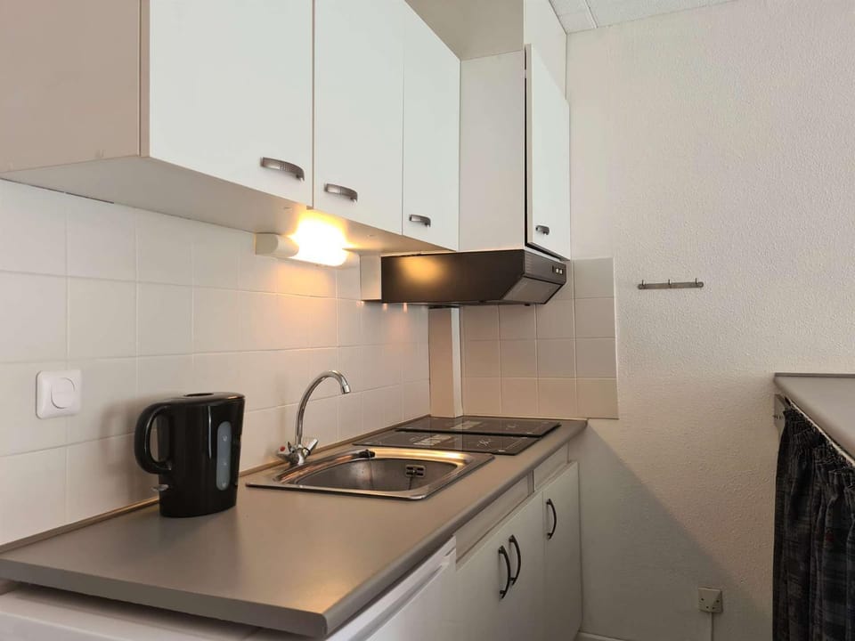 Kitchen or kitchenette, stove