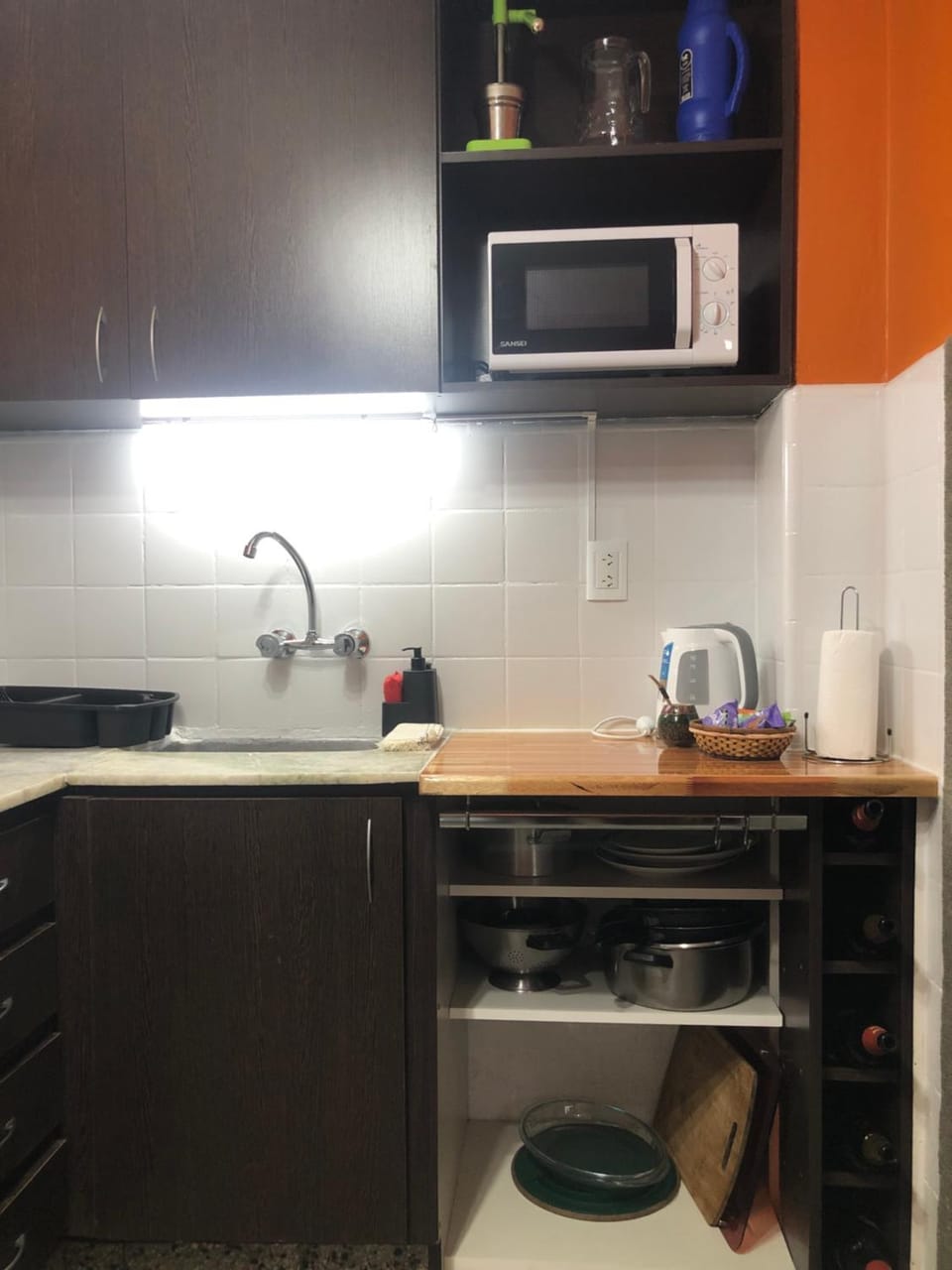 Kitchen or kitchenette, microwave, oven, stove
