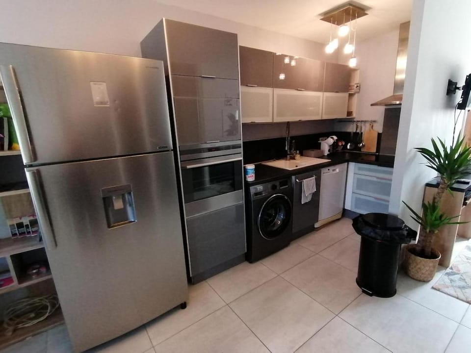Kitchen or kitchenette, dishwasher, oven, stove