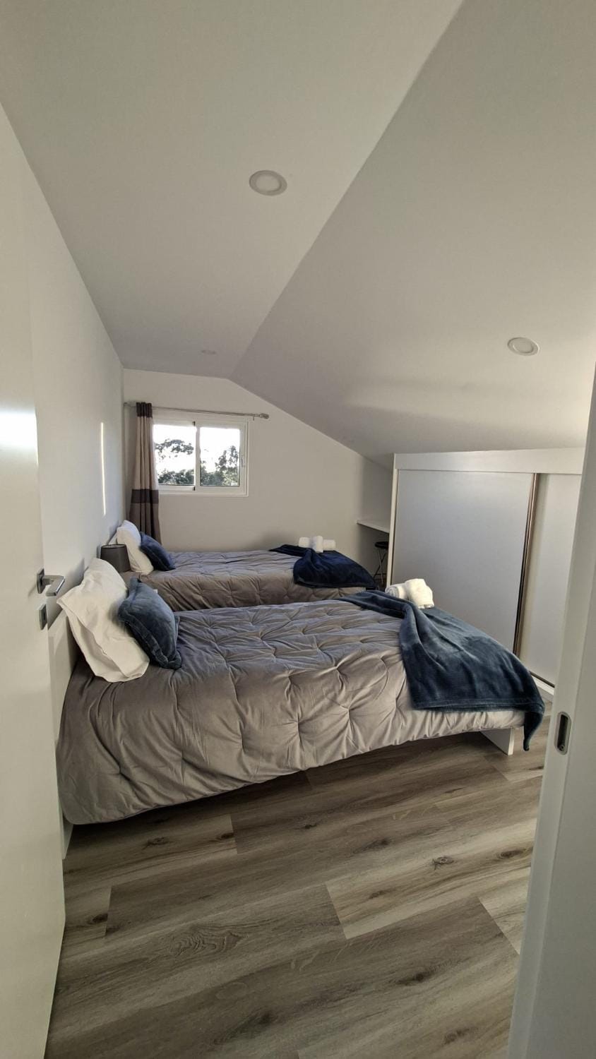 Bed, towels, wardrobe