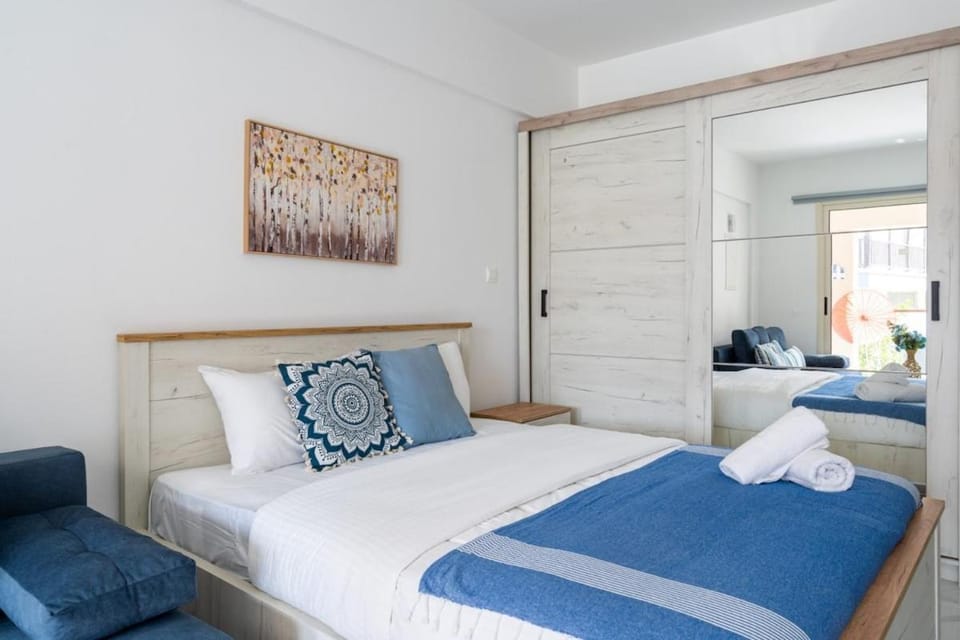 Bed, towels, wardrobe
