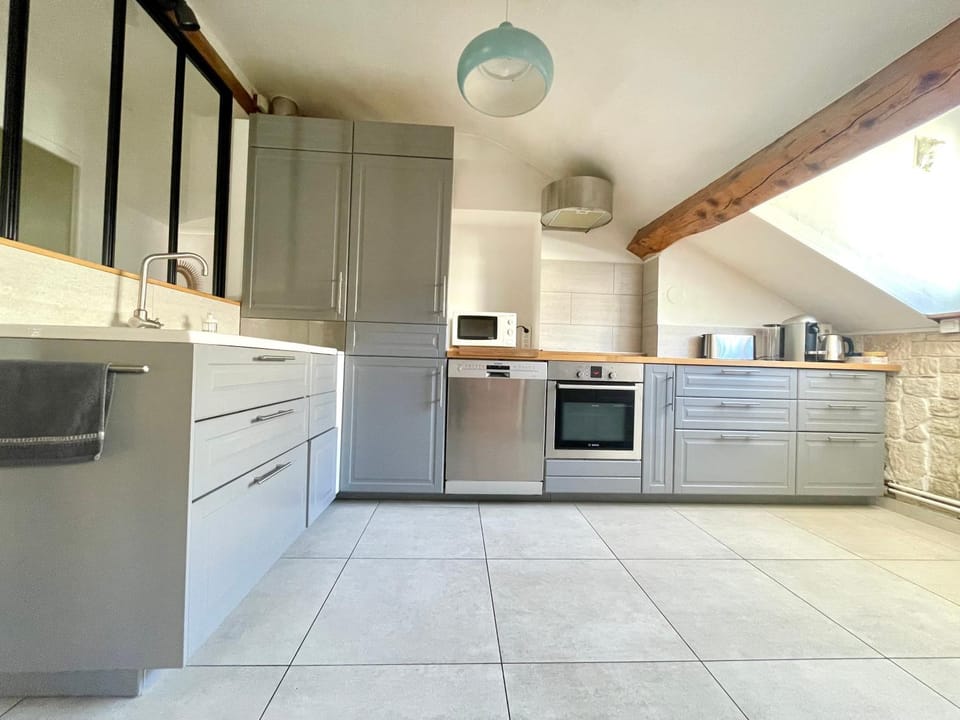 Kitchen or kitchenette, dishwasher, oven, stove, air conditioner