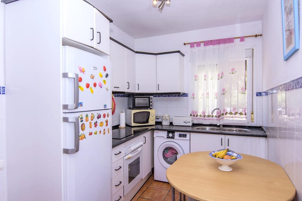Kitchen or kitchenette, Dining area, oven, stove, toaster, washing machine
