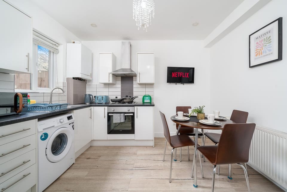 Living room, Seating area, Dining area, Garden view, Dinner, oven, stove, toaster, washing machine