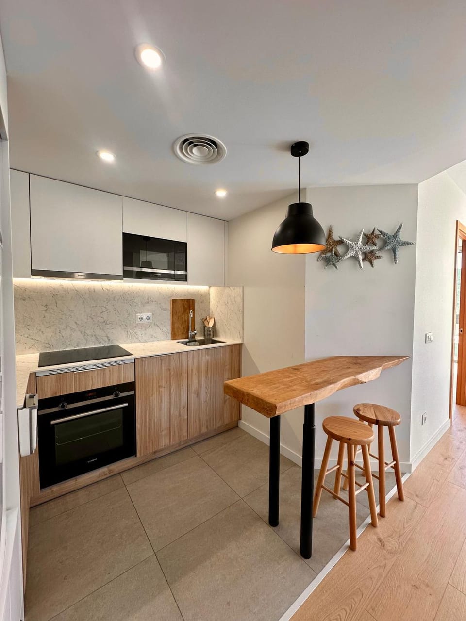Kitchen or kitchenette, dishwasher, microwave, oven, stove