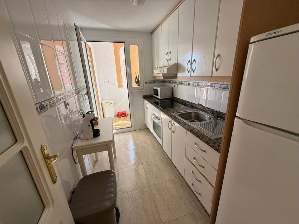 Kitchen or kitchenette, microwave, oven, stove, toaster