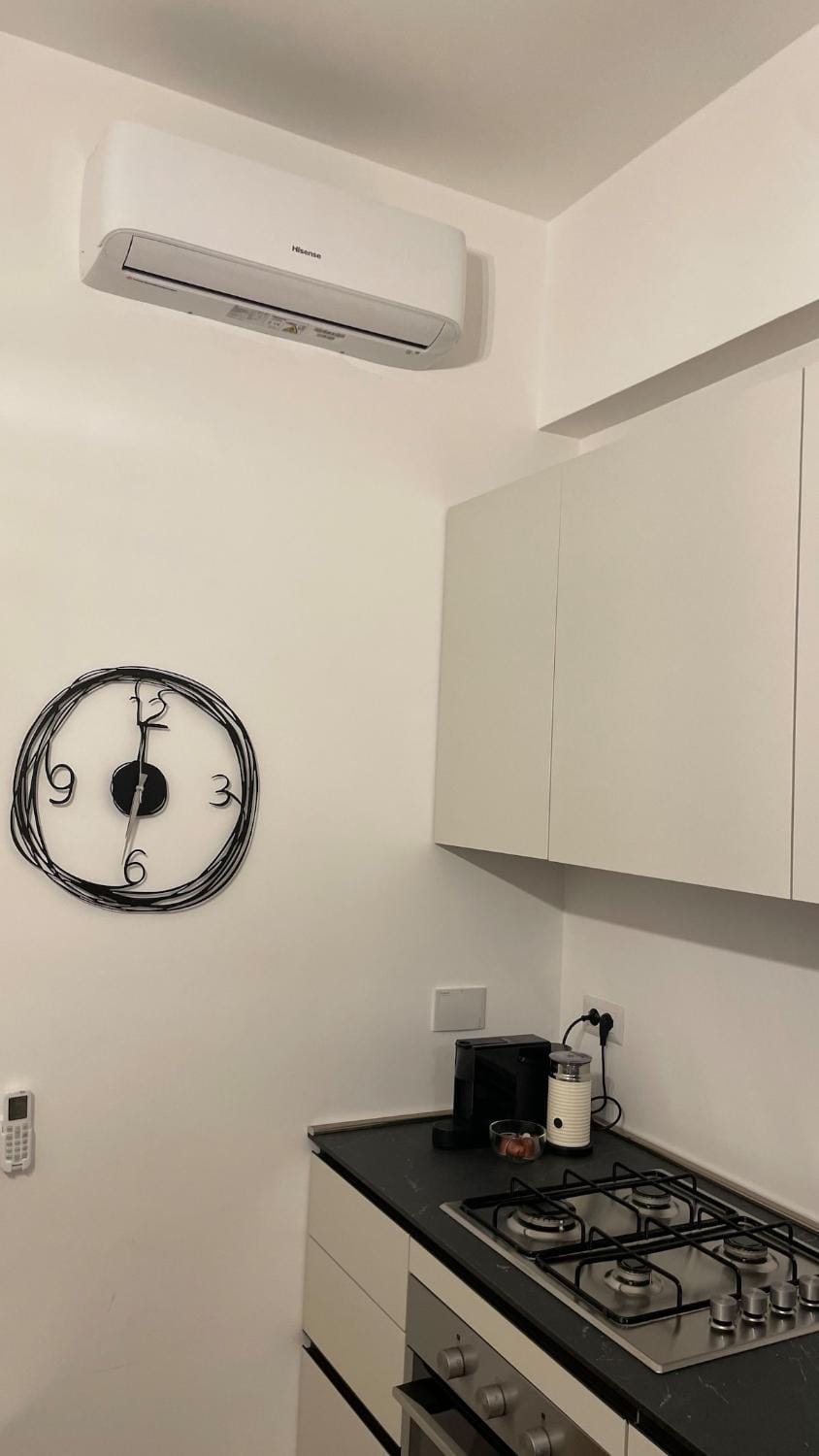 Kitchen or kitchenette, stove, air conditioner