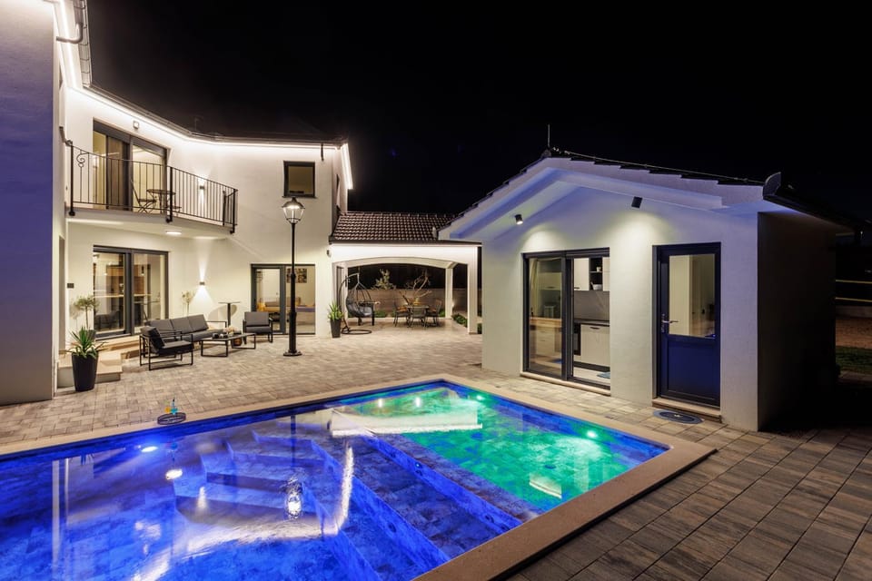 Property building, Patio, Night, Pool view, Swimming pool, Swimming pool