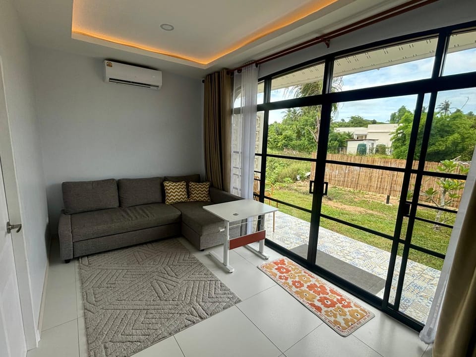 View (from property/room), Balcony/Terrace, Living room, Seating area, air conditioner