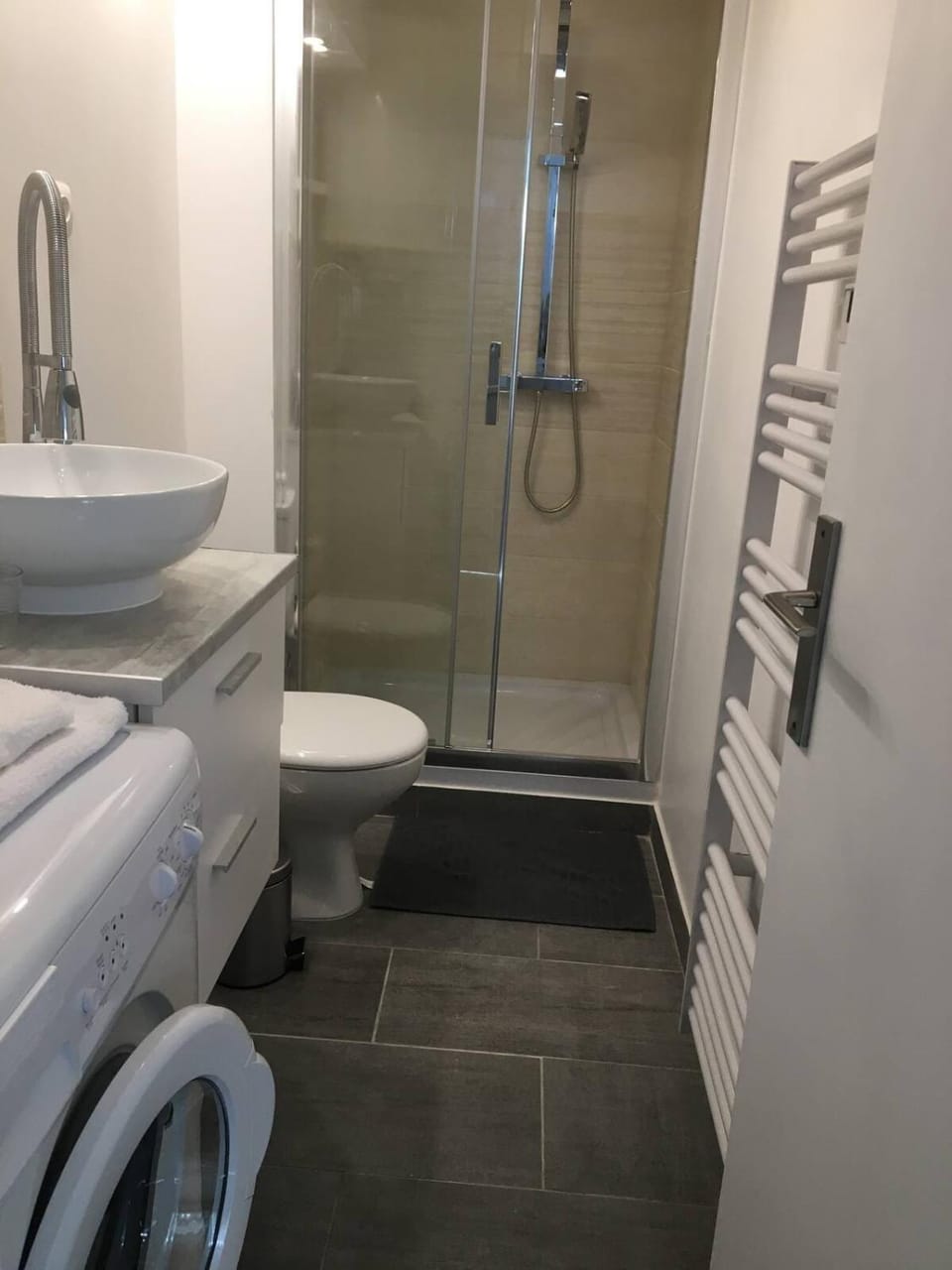 Shower, Toilet, Bathroom, towels, washing machine, dryer