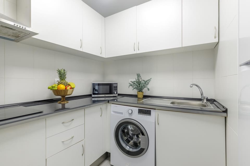 Kitchen or kitchenette, washing machine