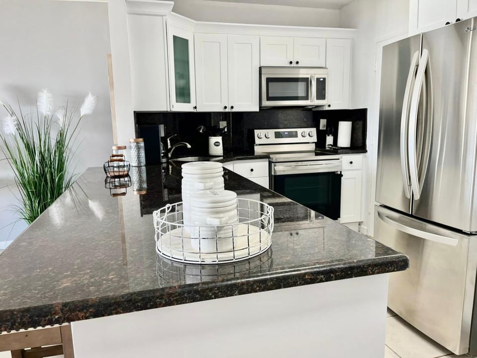 Kitchen or kitchenette, dishwasher, oven, stove, toaster