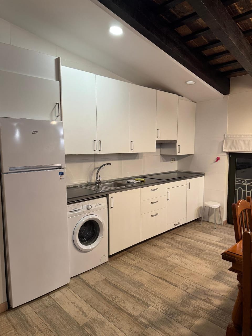 Kitchen or kitchenette, stove, washing machine