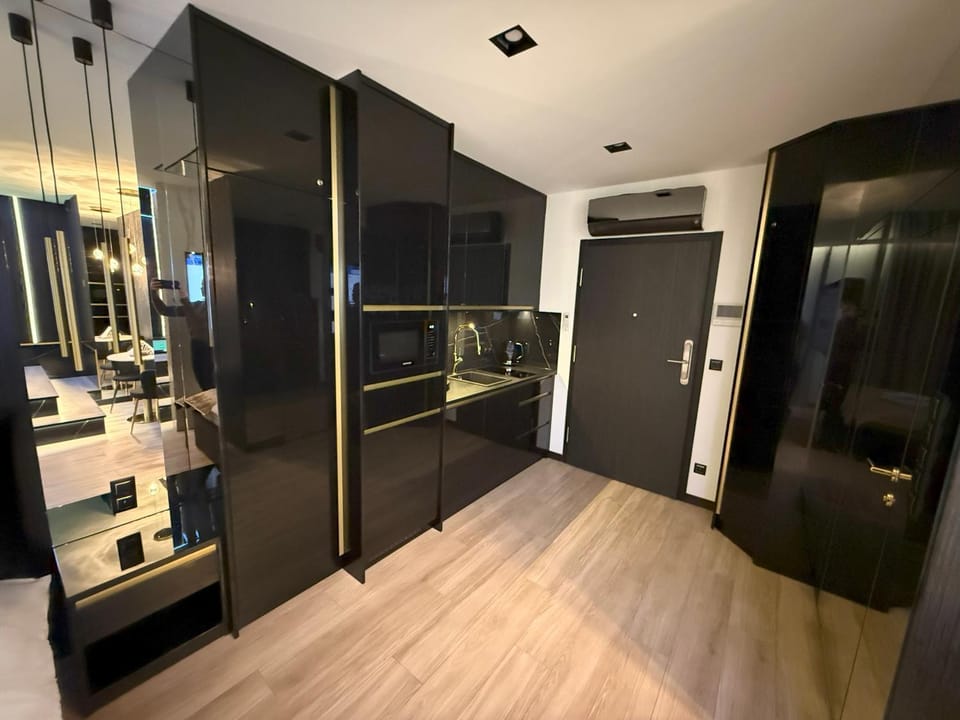 Kitchen or kitchenette, dishwasher, microwave, stove, wardrobe, air conditioner