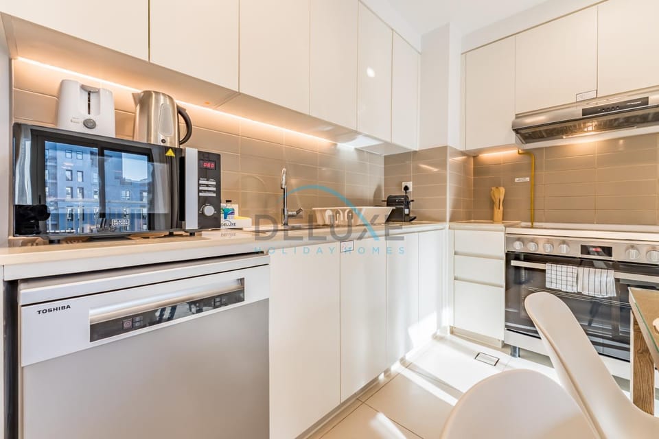 Kitchen or kitchenette, dishwasher, microwave, oven, stove, toaster