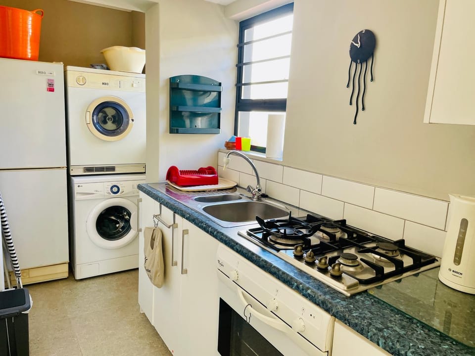 Kitchen or kitchenette, oven, stove, washing machine
