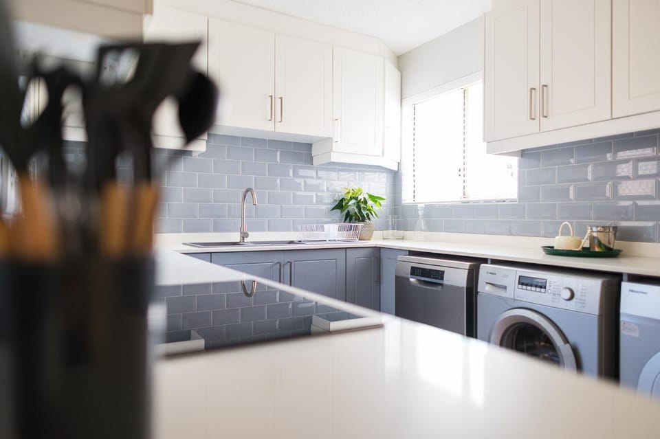 Kitchen or kitchenette, dishwasher, oven, stove, washing machine, dryer