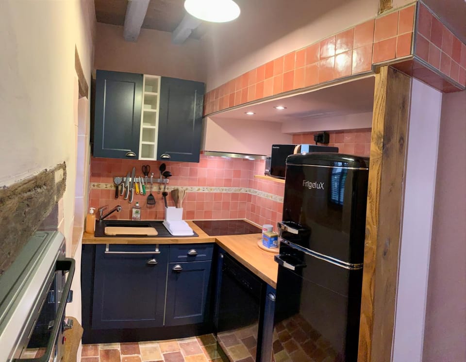 Kitchen or kitchenette, dishwasher, oven, stove