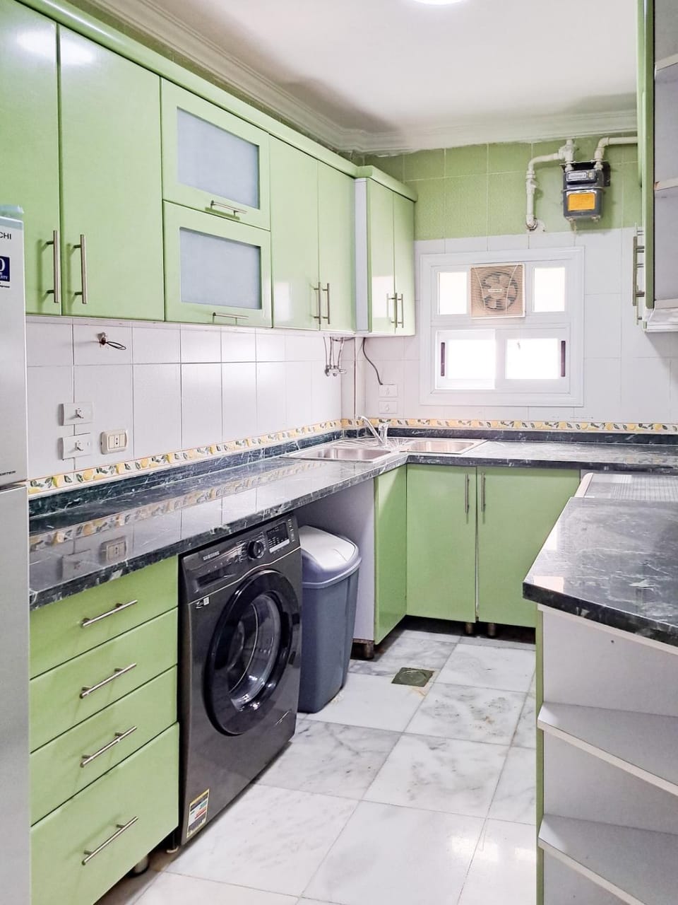 Kitchen or kitchenette, stove, washing machine