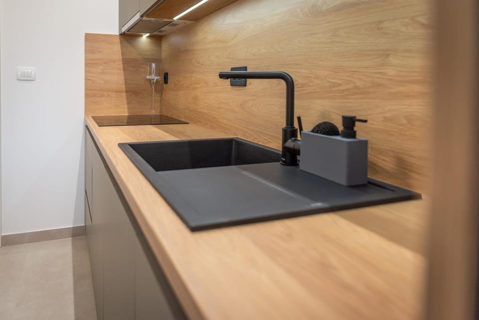 Kitchen or kitchenette, dishwasher, microwave, stove