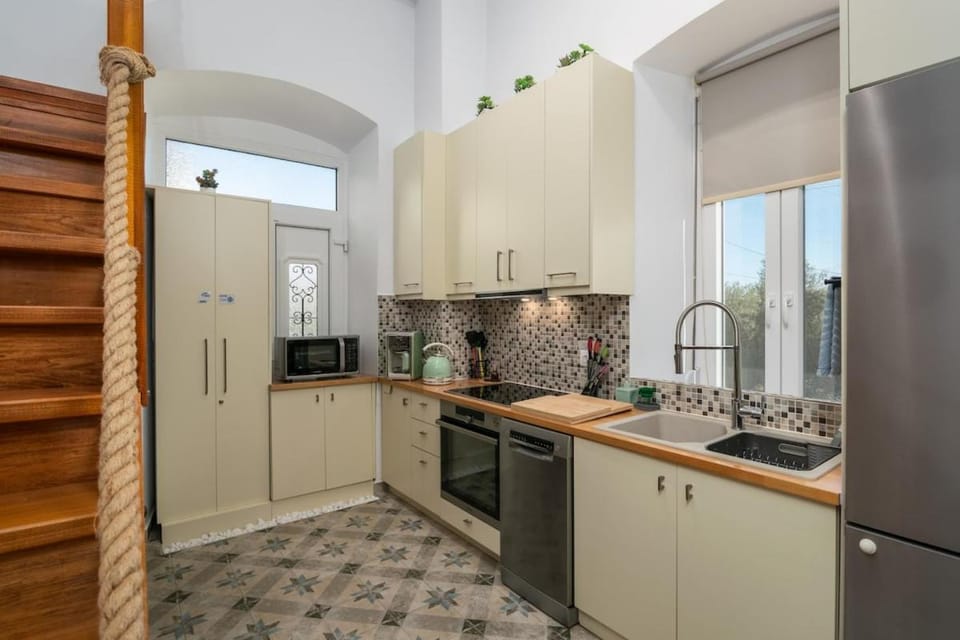 Kitchen or kitchenette, dishwasher, oven, stove, toaster