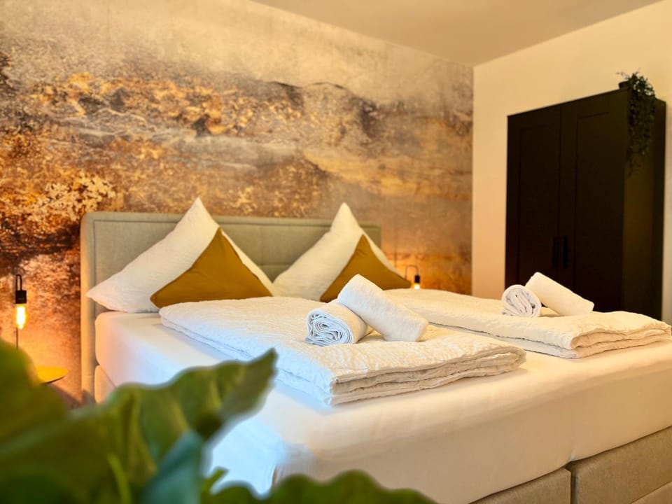 Bed, towels, wardrobe