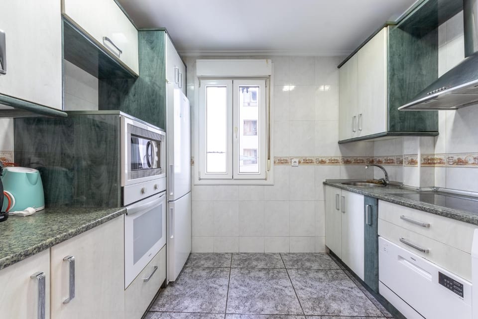 Kitchen or kitchenette, microwave, oven, stove