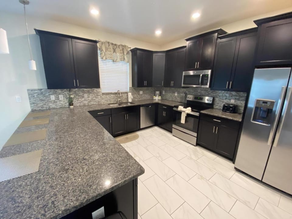 Kitchen or kitchenette, dishwasher, oven, stove, toaster
