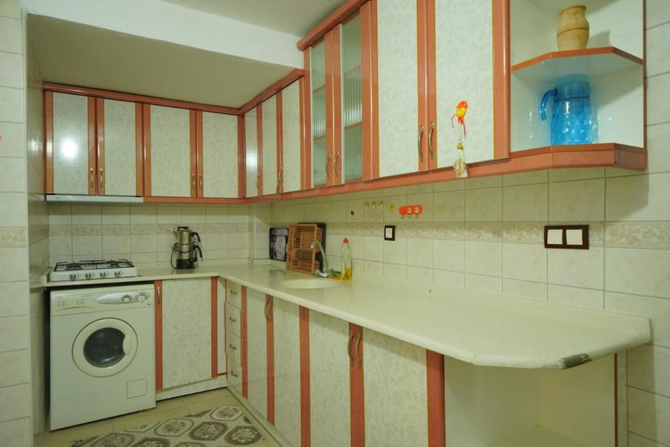 Kitchen or kitchenette, stove, washing machine